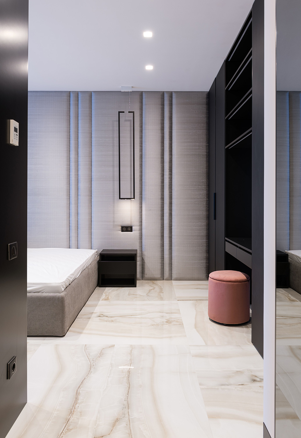 An image of a hallway looking into a bedroom.