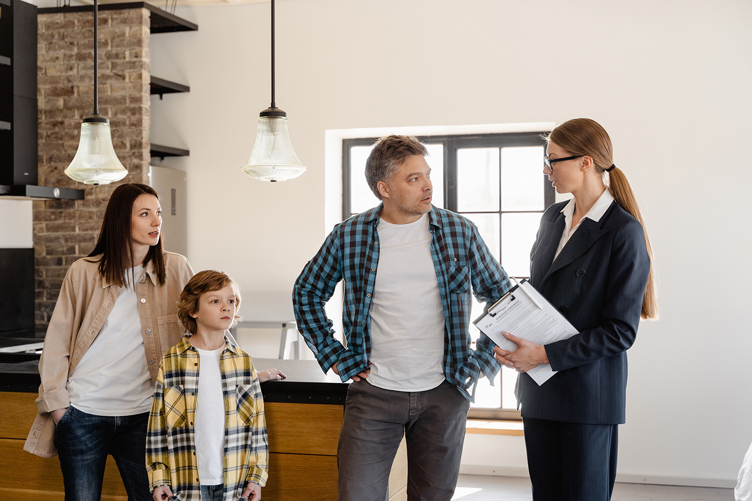 An image of a family talking to an estate agent.